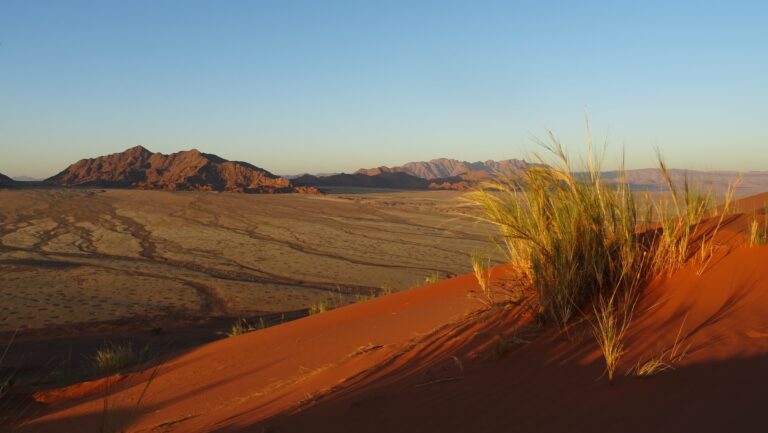 A few mountains looking from the top of a dune during a Sossusvlei camping safari.