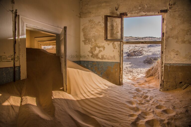 An abandoned building full of sand at Kolmanskop.